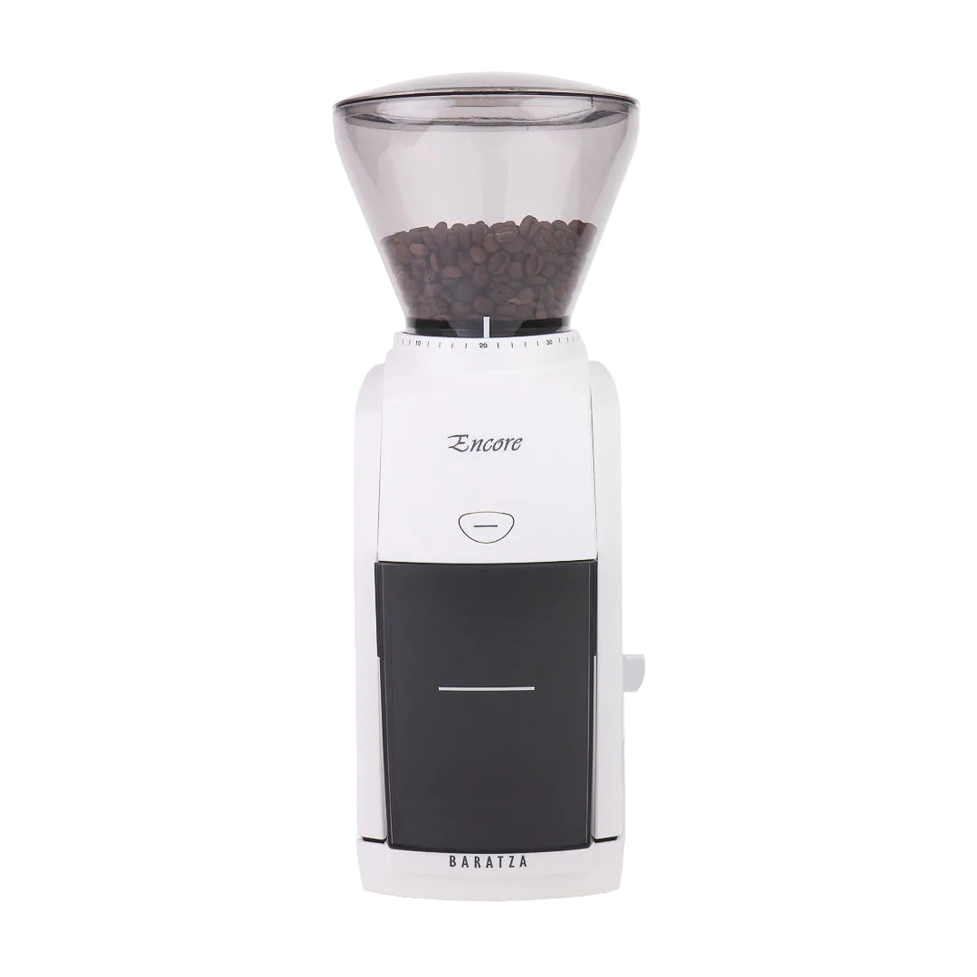 White and black coffee grinder with clear top containing coffee beans on a white background