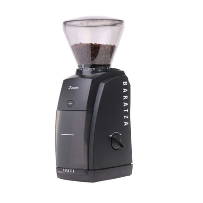 Baratza coffee grinder with coffee beans on a white background